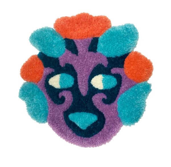 tufted forest creature mask in dark blue, medium purple, light blue, and reddish pink